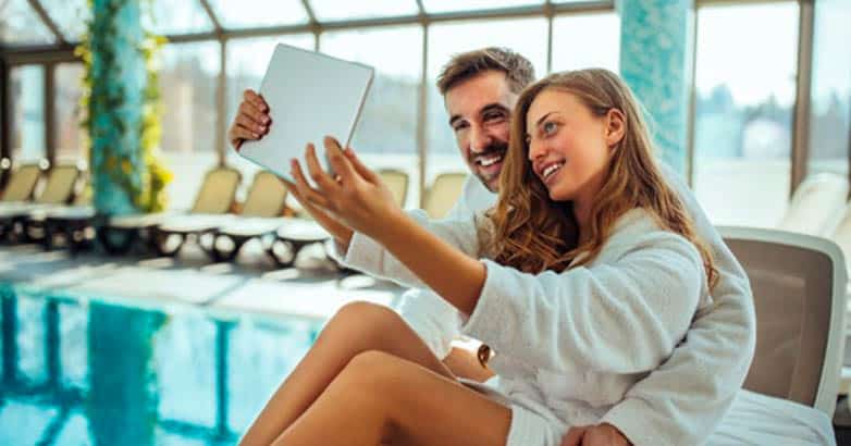 A couple takes pictures in the luxury hotels.