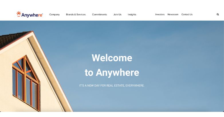 Inviting homepage banner of Anywhere Real Estate with a welcoming message against a blue sky background