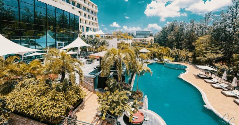 A serene view of the hotel pool, showcasing luxury and relaxation in a beautifully designed outdoor space.